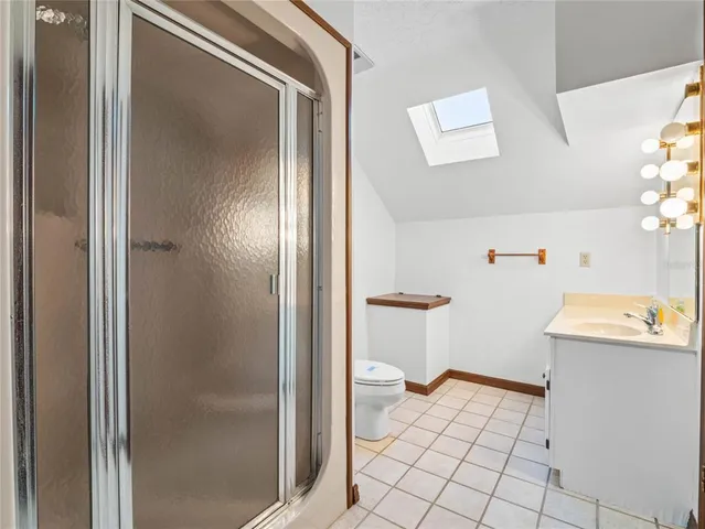 an aerial view of a houses with a lake view