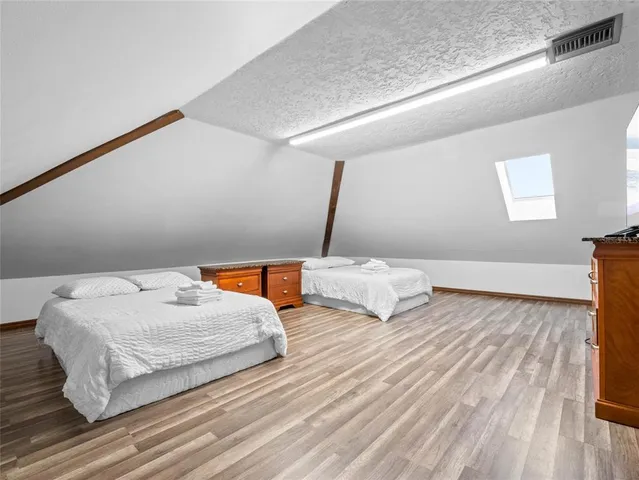 a view of a water with an outdoor space and seating area