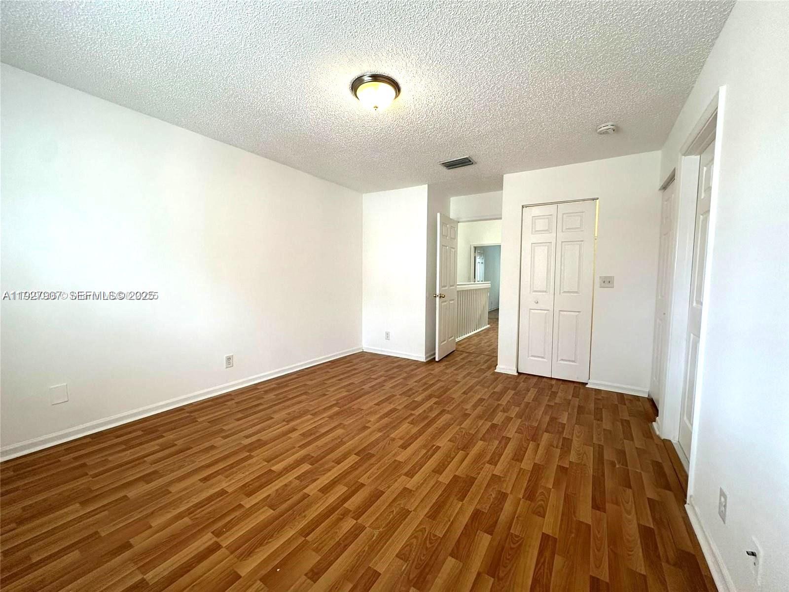 4855 Palmbrooke Circle, Unit 4855 West Palm Beach, FL 33417 - Photo 35 of 40 a view of empty room