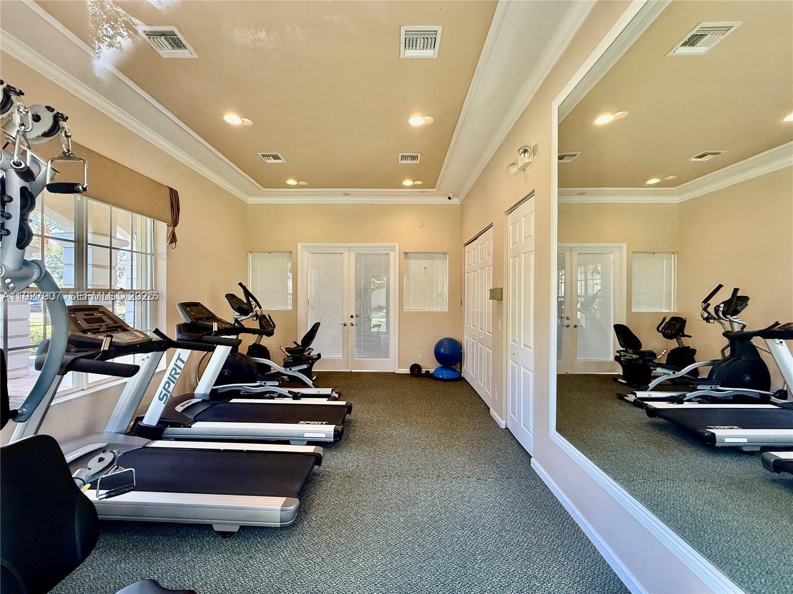 4855 Palmbrooke Circle, Unit 4855 West Palm Beach, FL 33417 - Photo 9 of 40 a view of a room with gym equipment