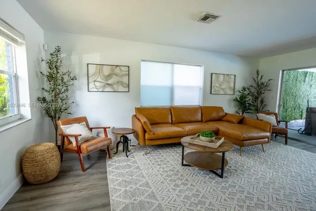 a living room with furniture and a window