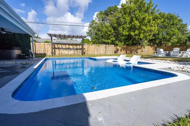 a view of a deck with a table and chairs