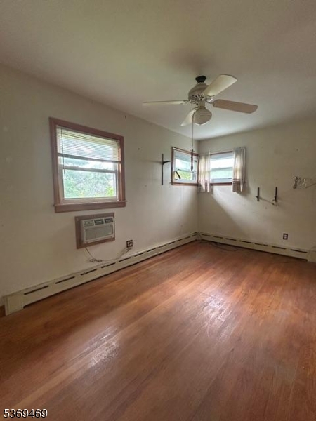 2044 Washington Valley Road Bridgewater, NJ 08836 - Photo 11 of 16 en empty room with windows and ceiling fan