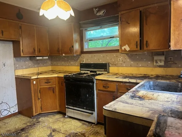 a kitchen with a stove and a sink