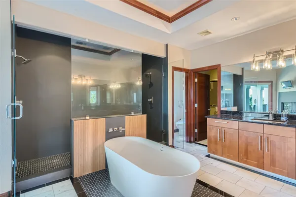 a large spacious bathroom with a large tub and sink