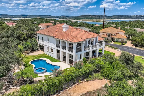 an aerial view of house with swimming pool