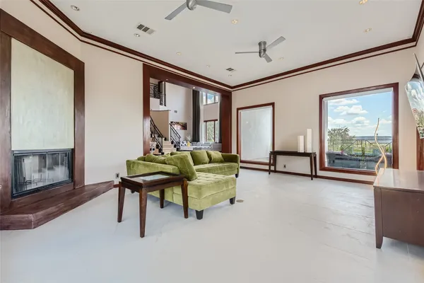 a kitchen with stainless steel appliances granite countertop table chairs sink refrigerator and cabinets