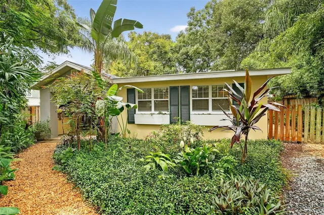 front view of a house with a garden