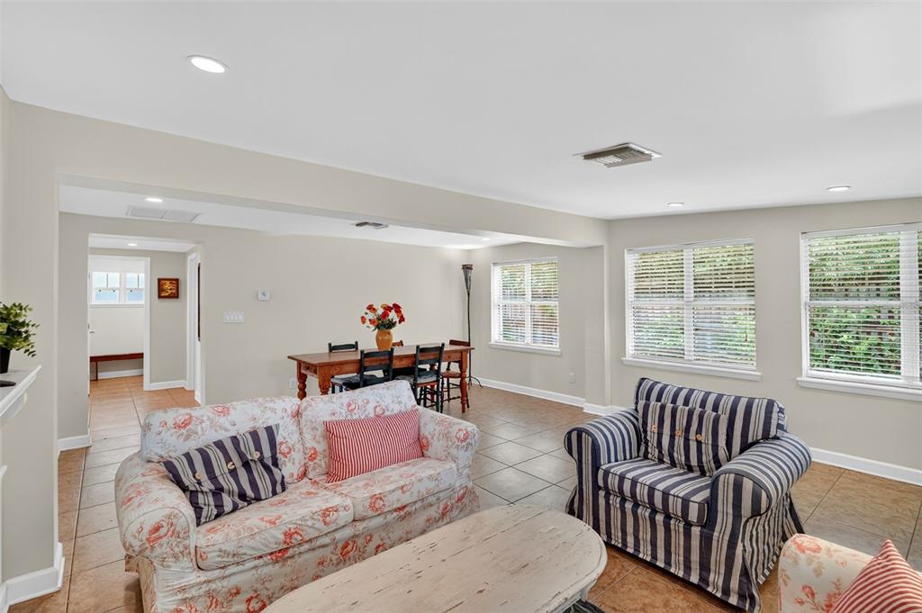 617 Robie Avenue Mount Dora, FL 32757 - Photo 11 of 26 a living room with furniture and a large window