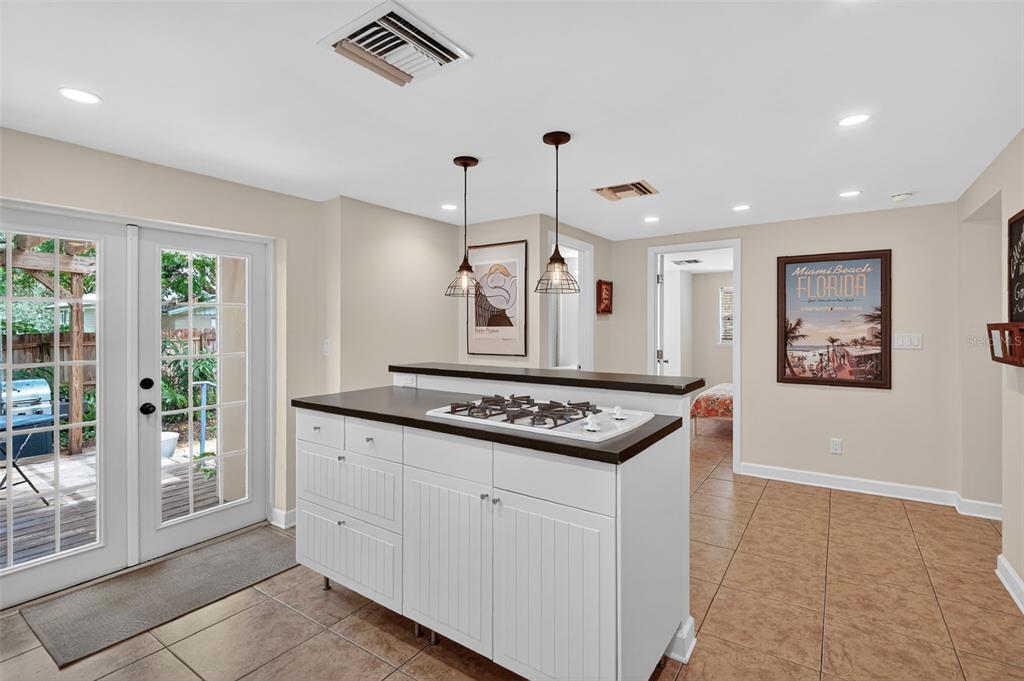 617 Robie Avenue Mount Dora, FL 32757 - Photo 16 of 26 a kitchen with stainless steel appliances granite countertop a stove a sink and a refrigerator