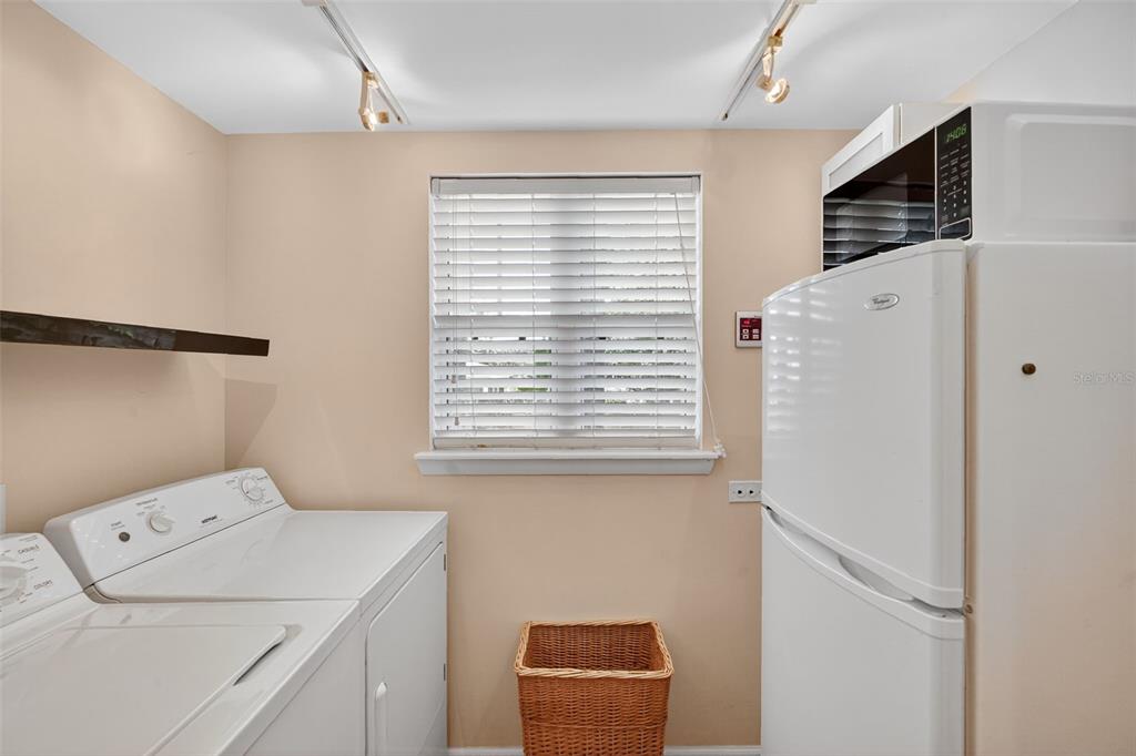 617 Robie Avenue Mount Dora, FL 32757 - Photo 17 of 26 a utility room with dryer and washer