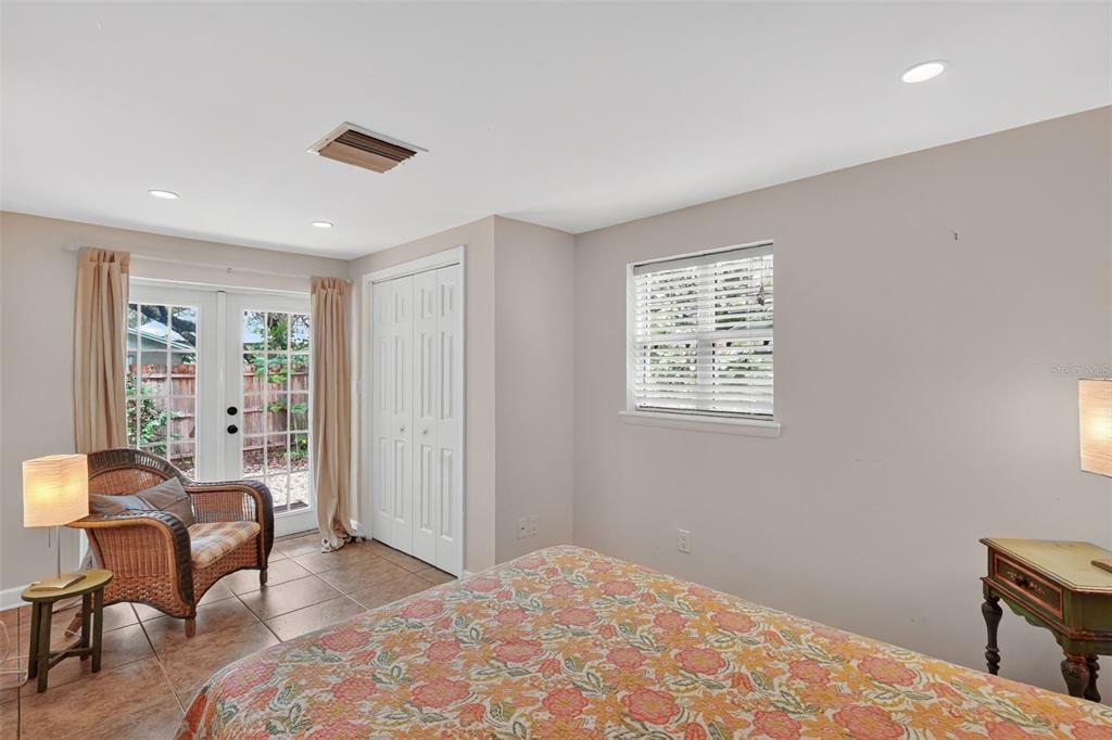 617 Robie Avenue Mount Dora, FL 32757 - Photo 19 of 26 a bedroom with furniture and a window