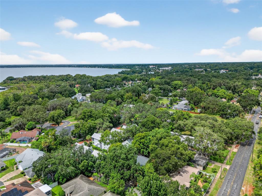 617 Robie Avenue Mount Dora, FL 32757 - Photo 25 of 26 an aerial view of a houses with a yard