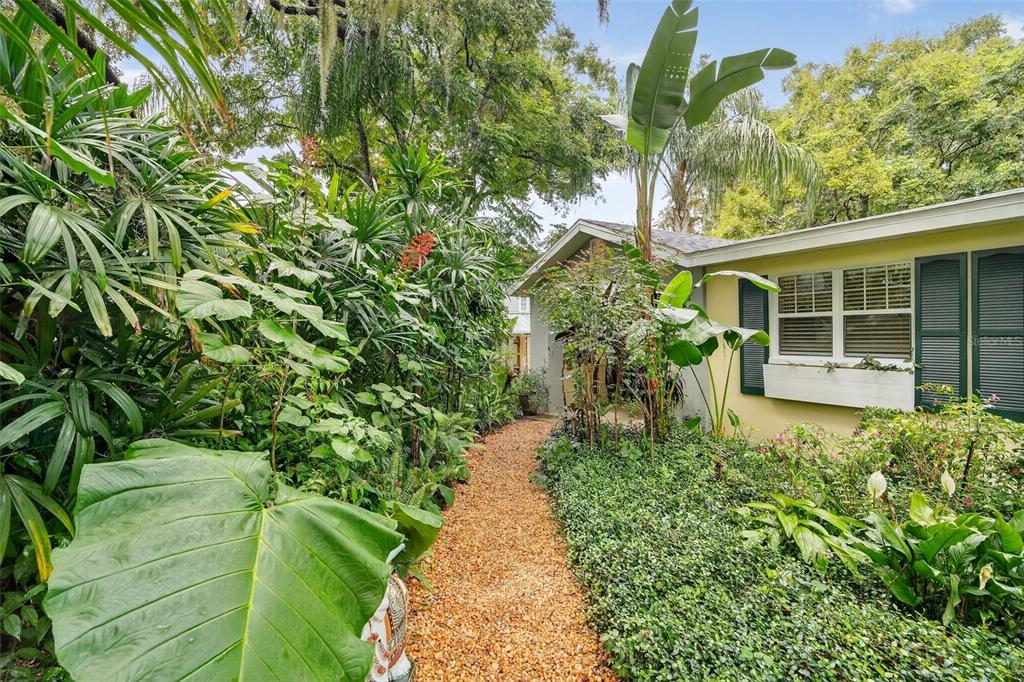 617 Robie Avenue Mount Dora, FL 32757 - Photo 3 of 26 a view of a garden with pathway