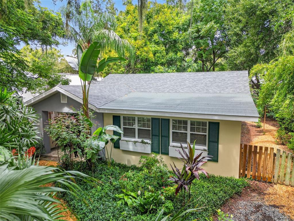 617 Robie Avenue Mount Dora, FL 32757 - Photo 4 of 26 a house with trees in front of it