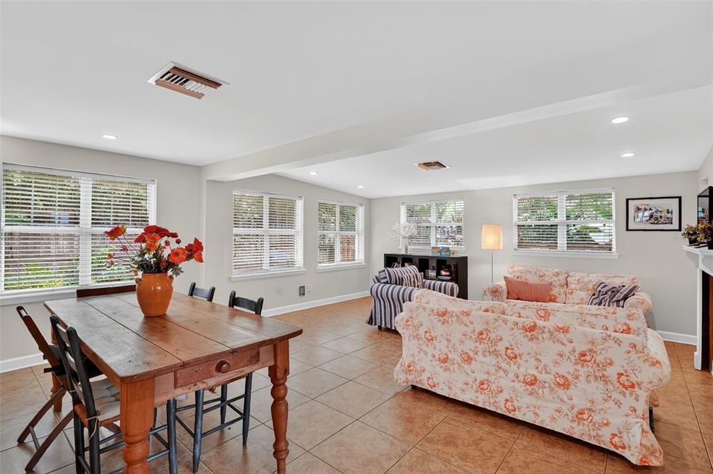 617 Robie Avenue Mount Dora, FL 32757 - Photo 8 of 26 a living room with furniture and a table