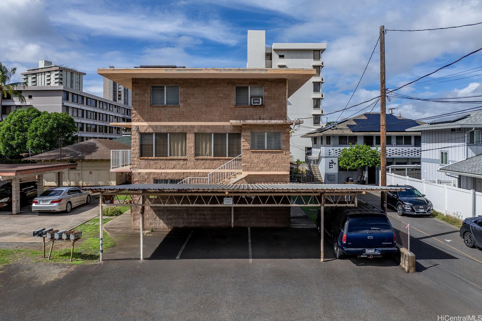 906 Hausten Street Honolulu, HI 96826 - Photo 14 of 21 a view of a patio with table and chairs and potted plants