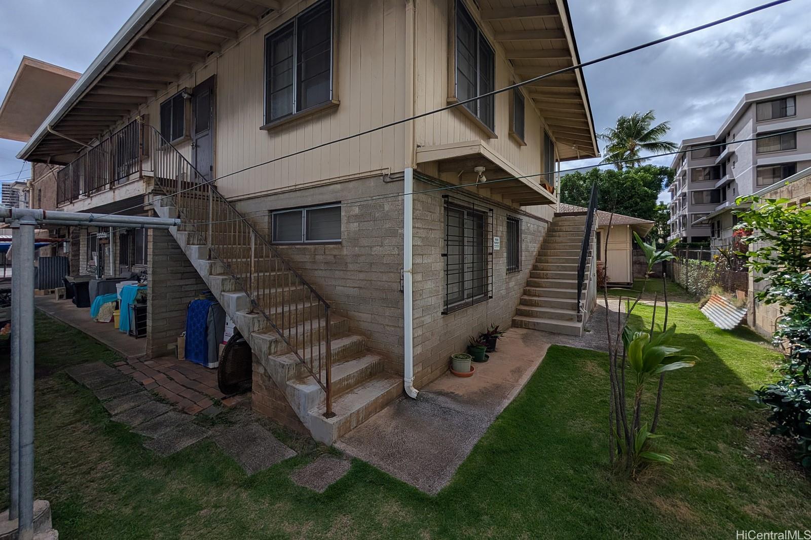 906 Hausten Street Honolulu, HI 96826 - Photo 9 of 21 a view of house with a yard