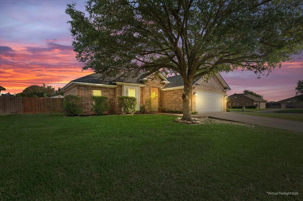 10285 Peony Lane Waco, TX 76708 - Photo 1 of 1 View of front of house featuring driveway, brick siding, and a garage