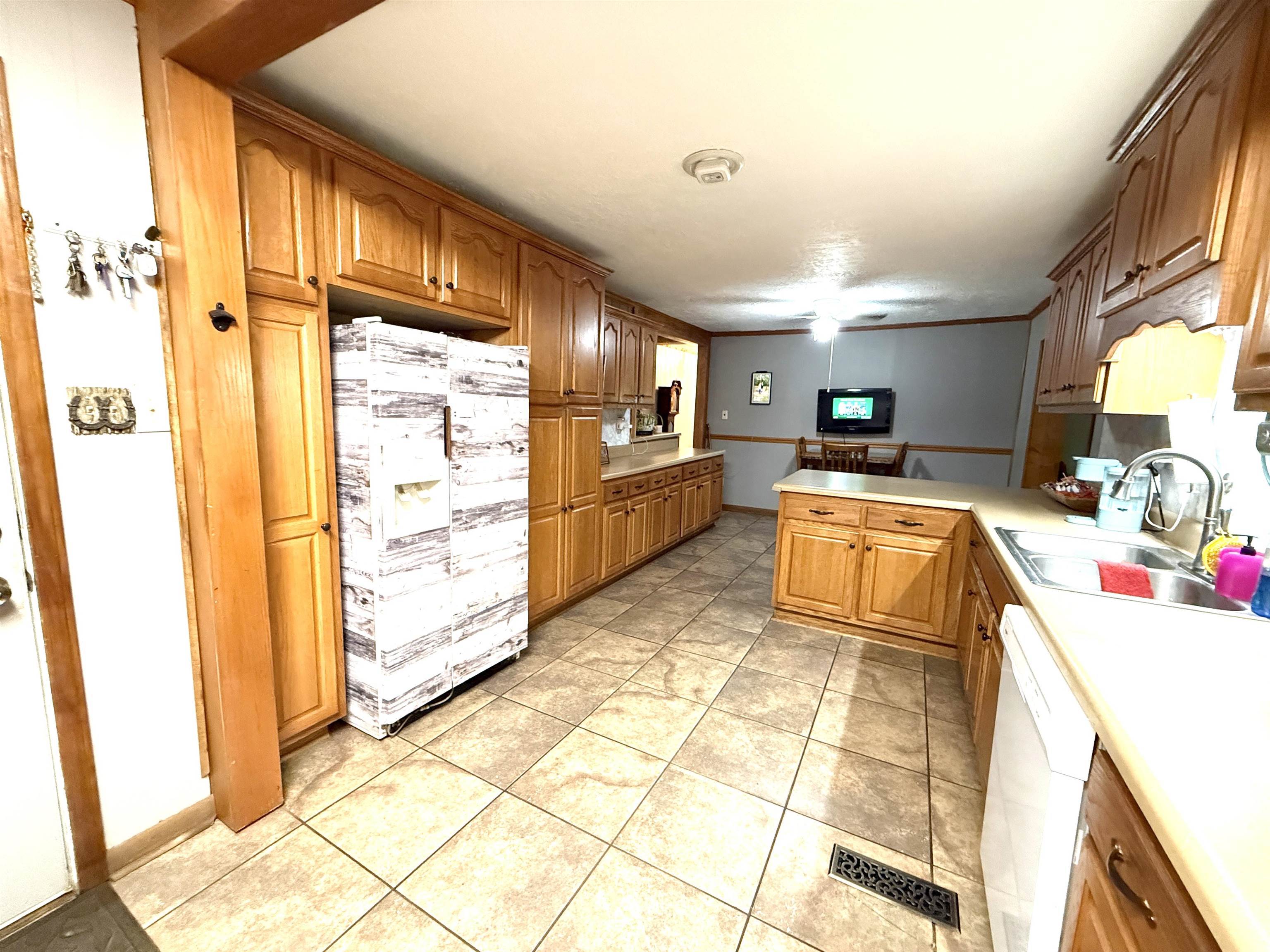 127 Harvey Newman Road Gates, TN 38037 - Photo 12 of 40 a kitchen with stainless steel appliances granite countertop a refrigerator and a stove