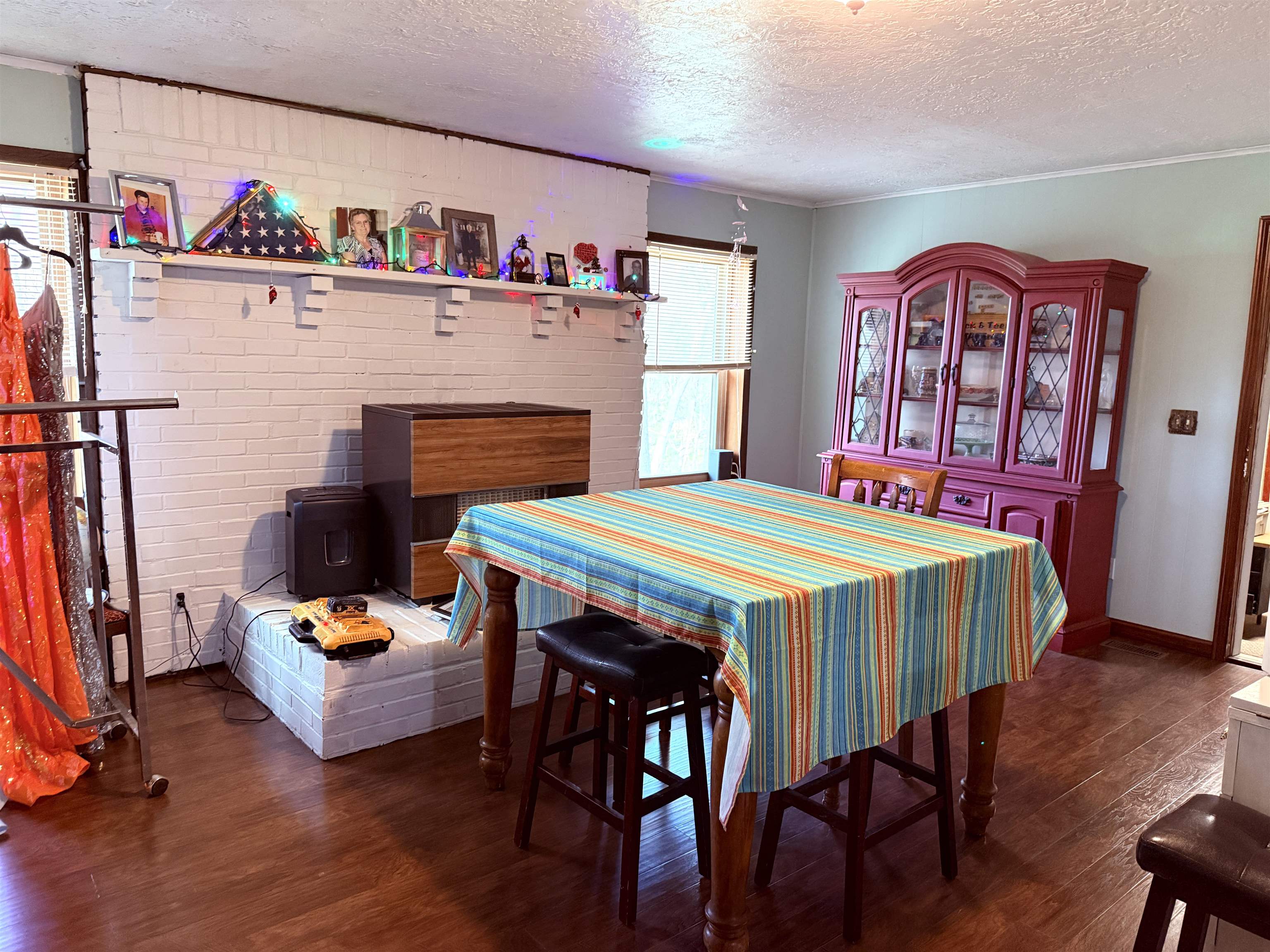 127 Harvey Newman Road Gates, TN 38037 - Photo 16 of 40 a bedroom with a bed and a bookshelf with wooden floor