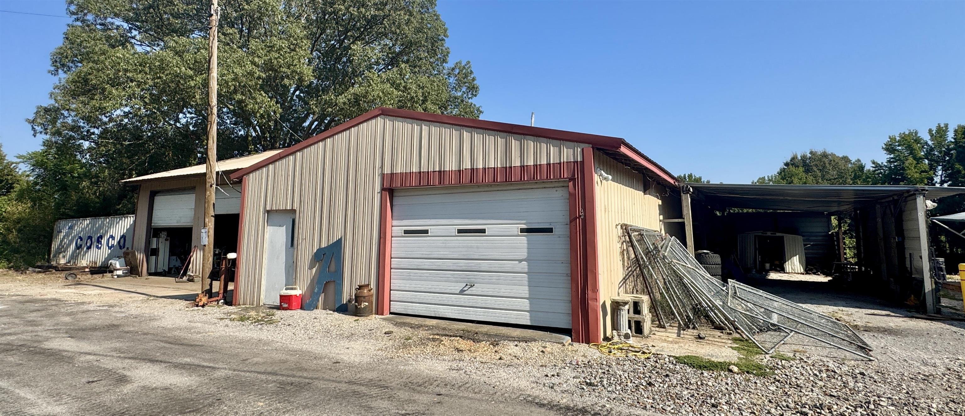 127 Harvey Newman Road Gates, TN 38037 - Photo 24 of 40 a view of a house with a garage