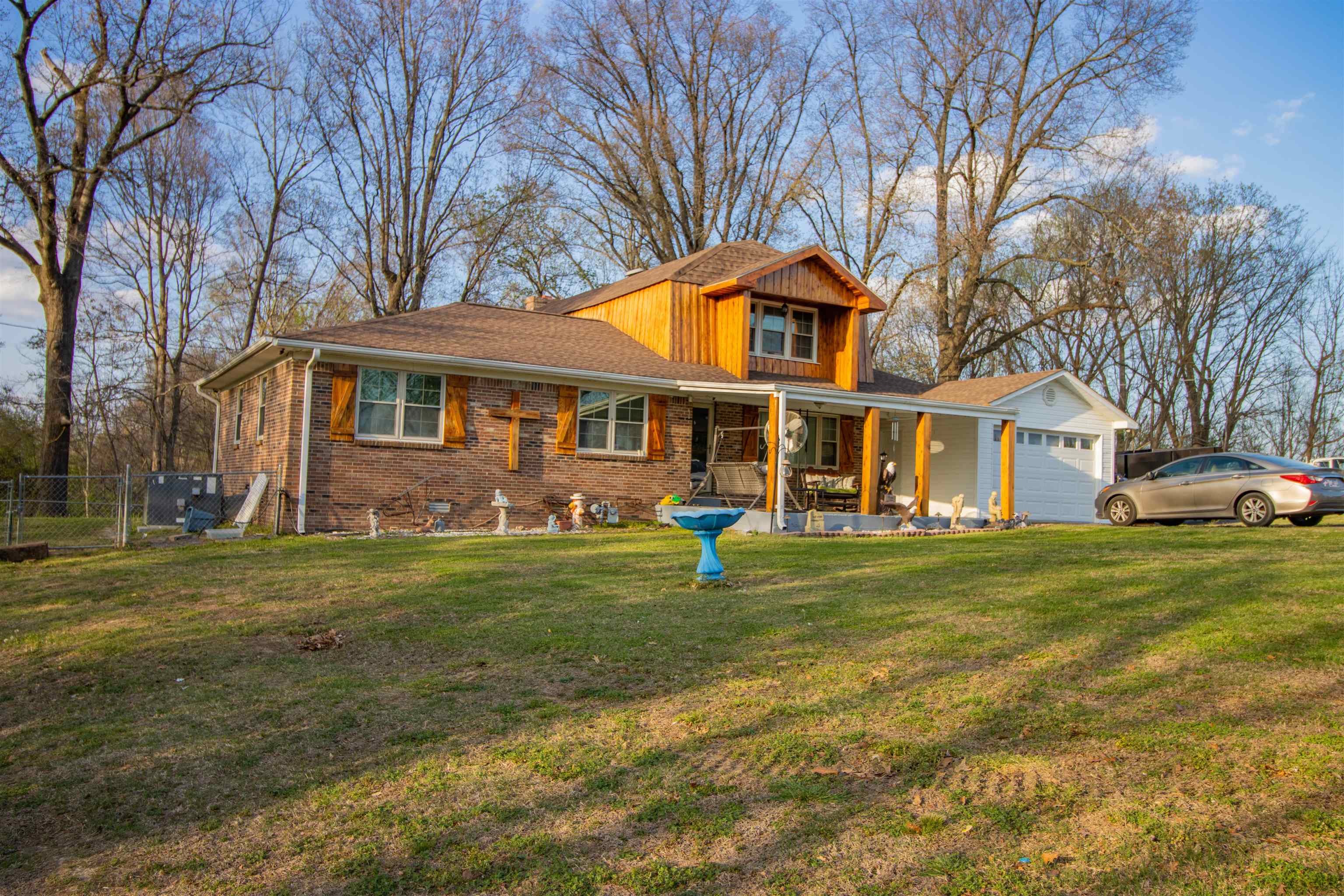 127 Harvey Newman Road Gates, TN 38037 - Photo 3 of 40 a front view of a house with a garden