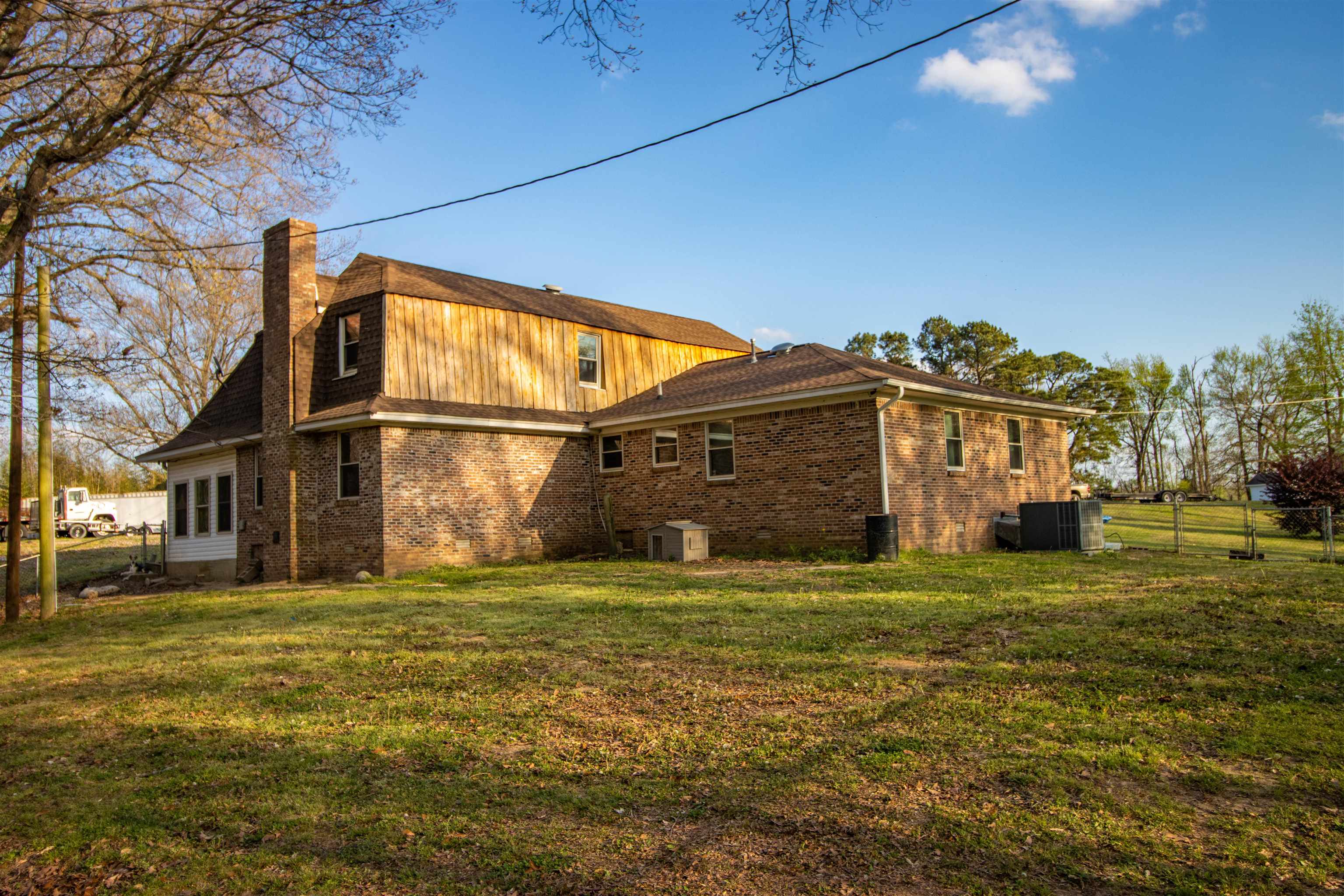 127 Harvey Newman Road Gates, TN 38037 - Photo 5 of 40 a view of a big house with a big yard and large trees