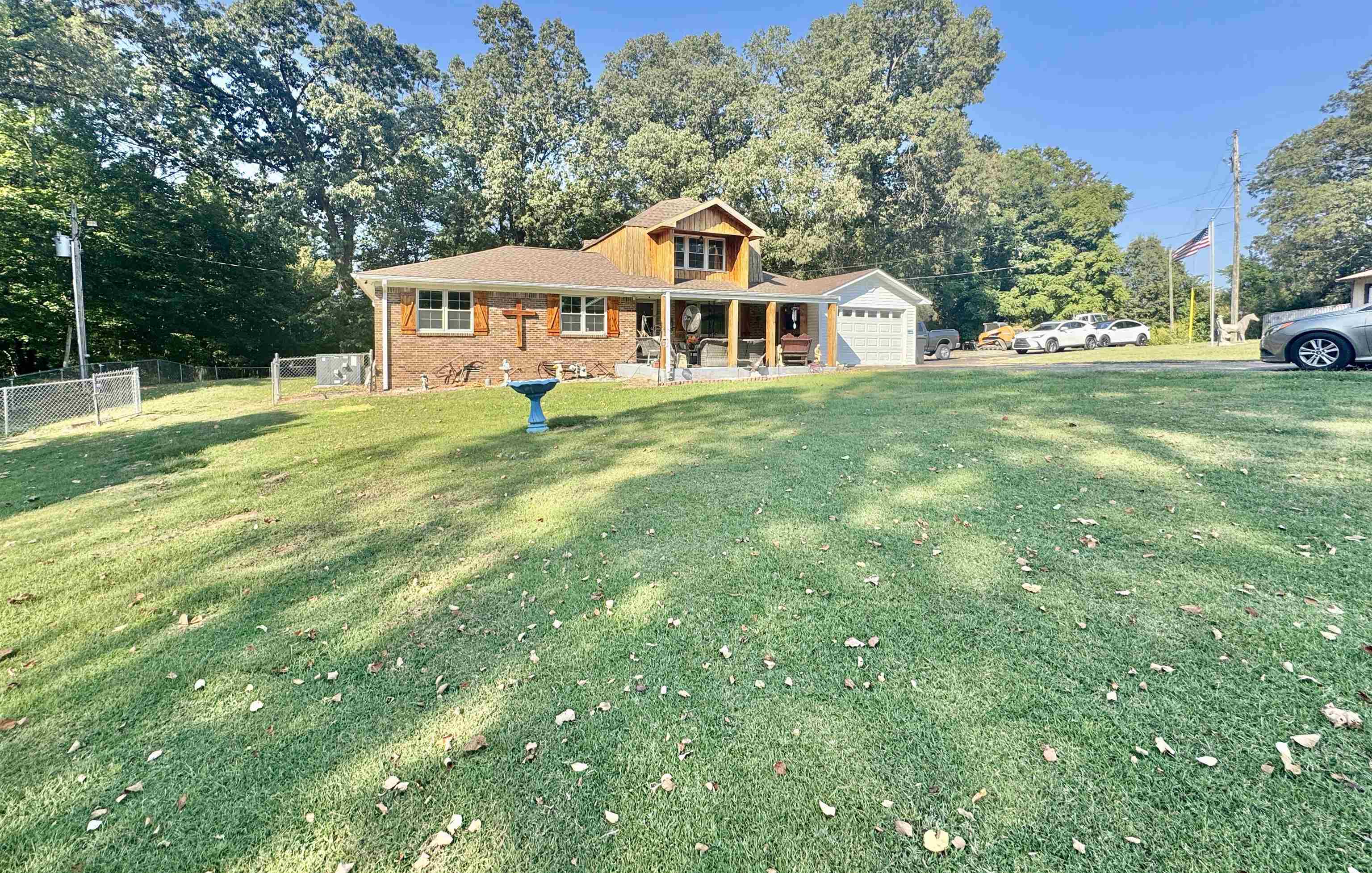 127 Harvey Newman Road Gates, TN 38037 - Photo 7 of 40 a front of a house with a big yard and large trees