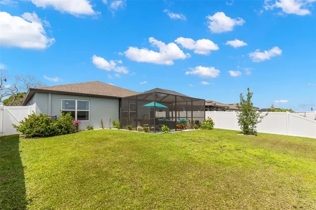 a front view of house with yard and trees