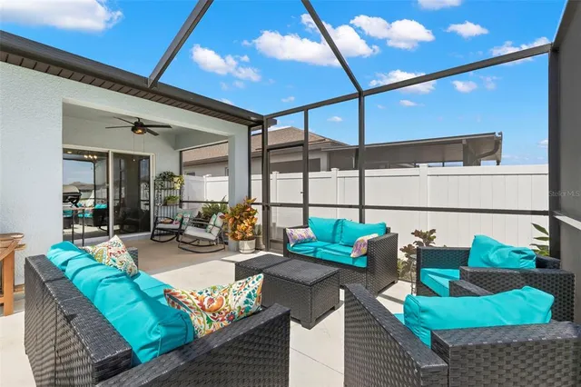 a bedroom with a bed a chandelier and a window