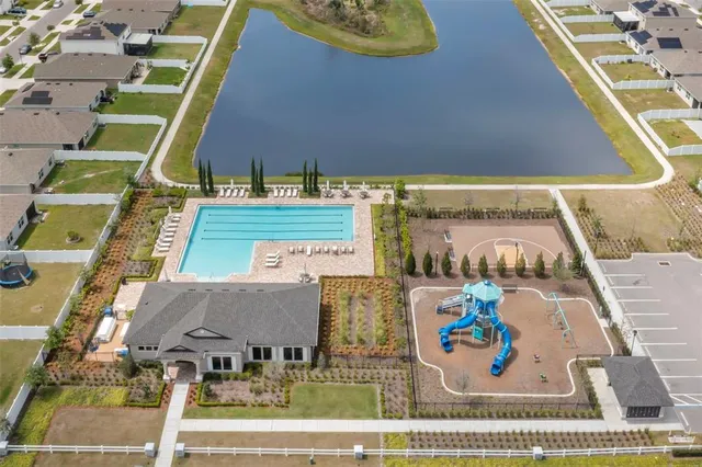 a view of a swimming pool with a yard