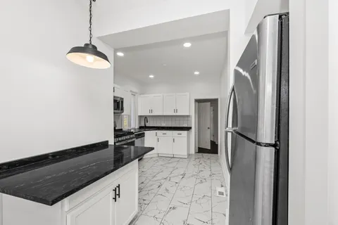 $394,999 | 7832 South Paxton Avenue, Chicago, IL 60649