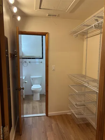 a bathroom with a shower and a toilet