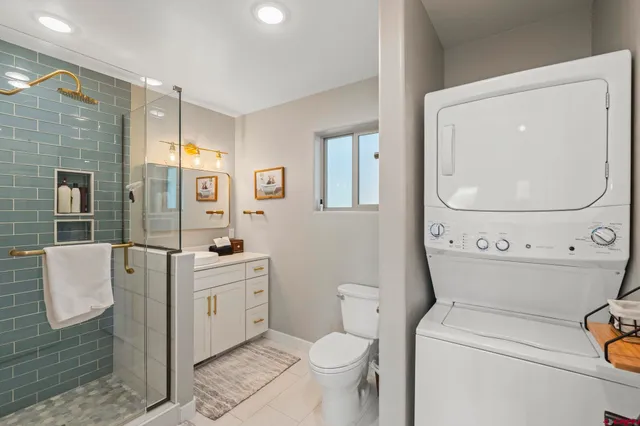 a bathroom with a toilet sink and tub