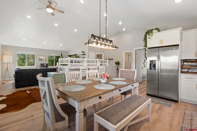 a kitchen with a table and chairs