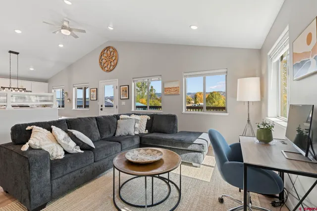 a living room with furniture and a window