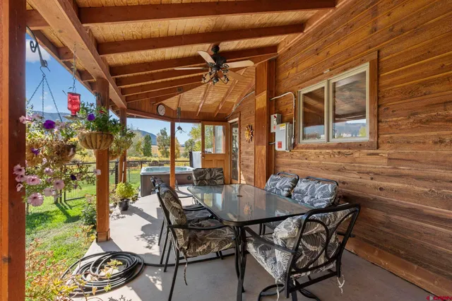 a table and chairs in front of a house