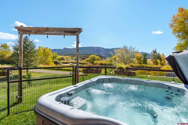 a view of swimming pool with a chairs