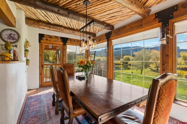 a dining room with furniture and window