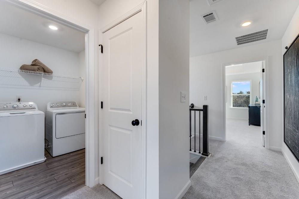 3197 Eastham Run Drive Dacula, GA 30019 - Photo 22 of 34 a view of a hallway with closet and wooden floor