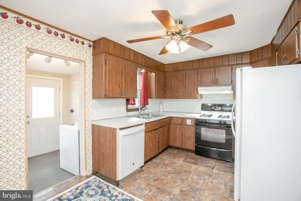 a kitchen with cabinets and stainless steel appliances