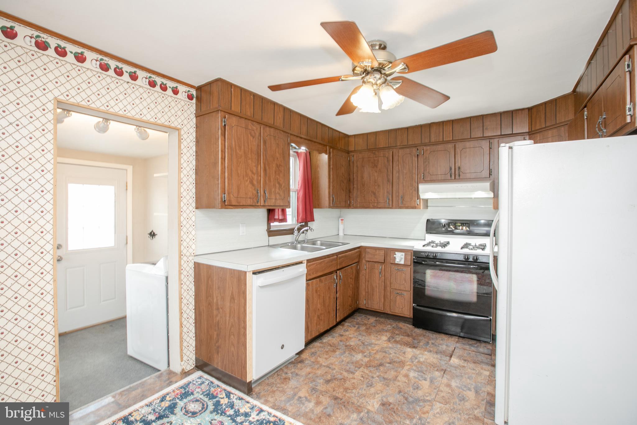 2414 Hamilton Avenue Hamilton, NJ 08619 - Photo 11 of 31 a kitchen with cabinets and stainless steel appliances