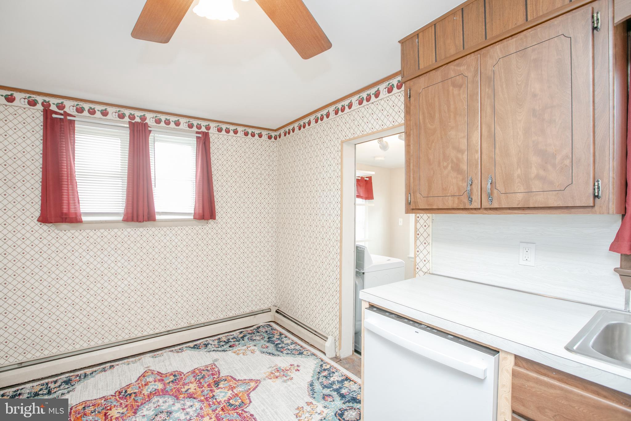 2414 Hamilton Avenue Hamilton, NJ 08619 - Photo 13 of 31 a kitchen with a white cabinets and white appliances