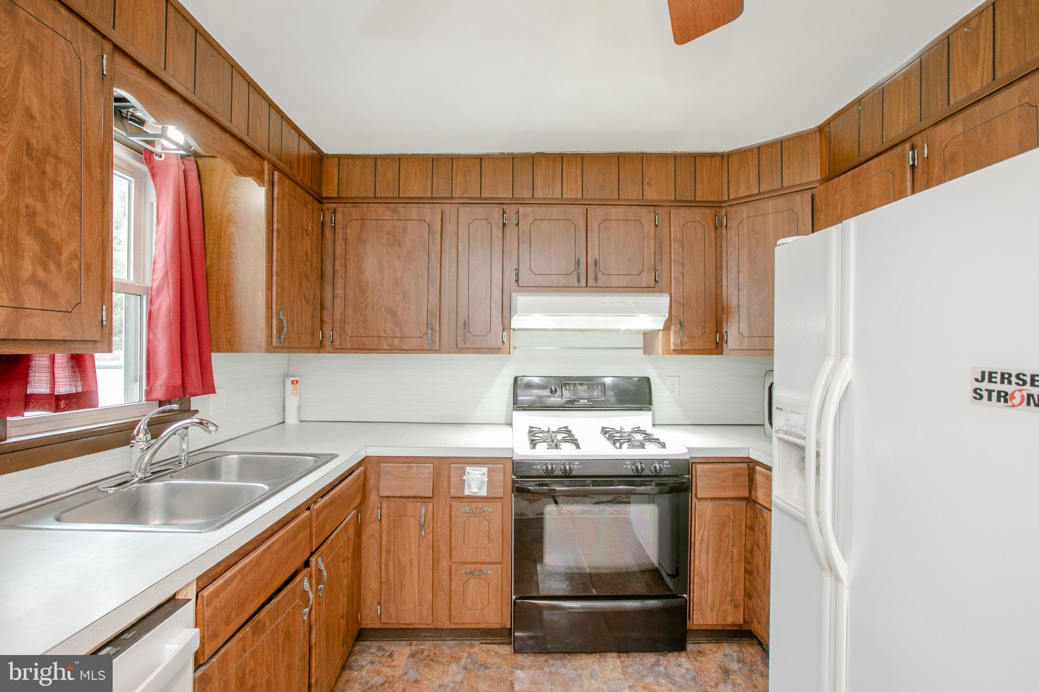 2414 Hamilton Avenue Hamilton, NJ 08619 - Photo 14 of 31 a kitchen with a refrigerator and a sink