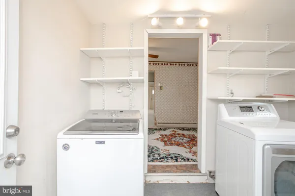 a utility room with dryer and washer