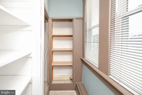 a view of a hallway with a window