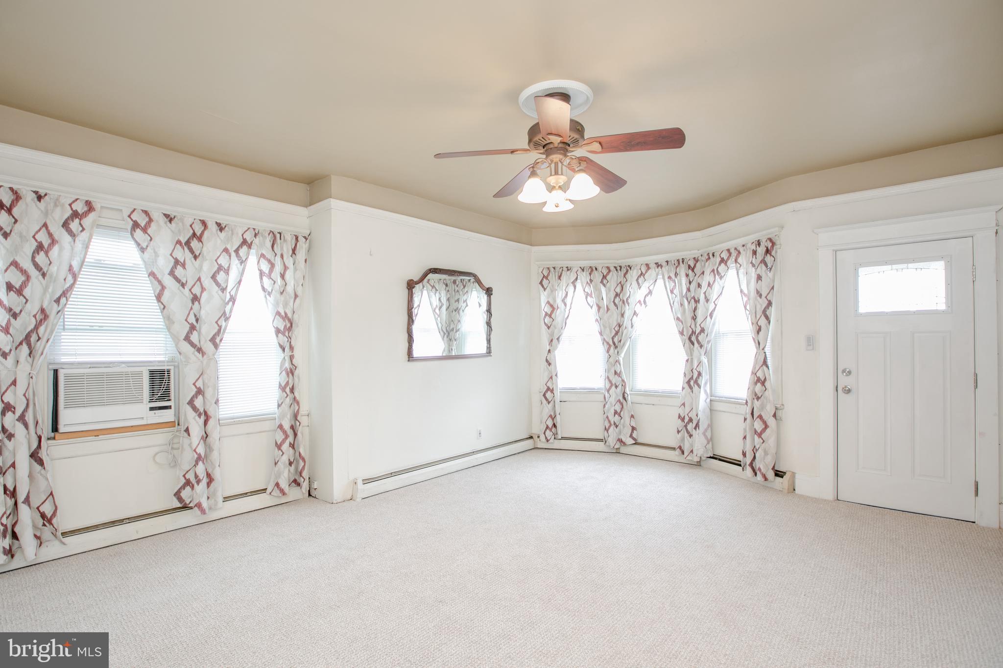 2414 Hamilton Avenue Hamilton, NJ 08619 - Photo 7 of 31 wooden floor in an empty room with a window
