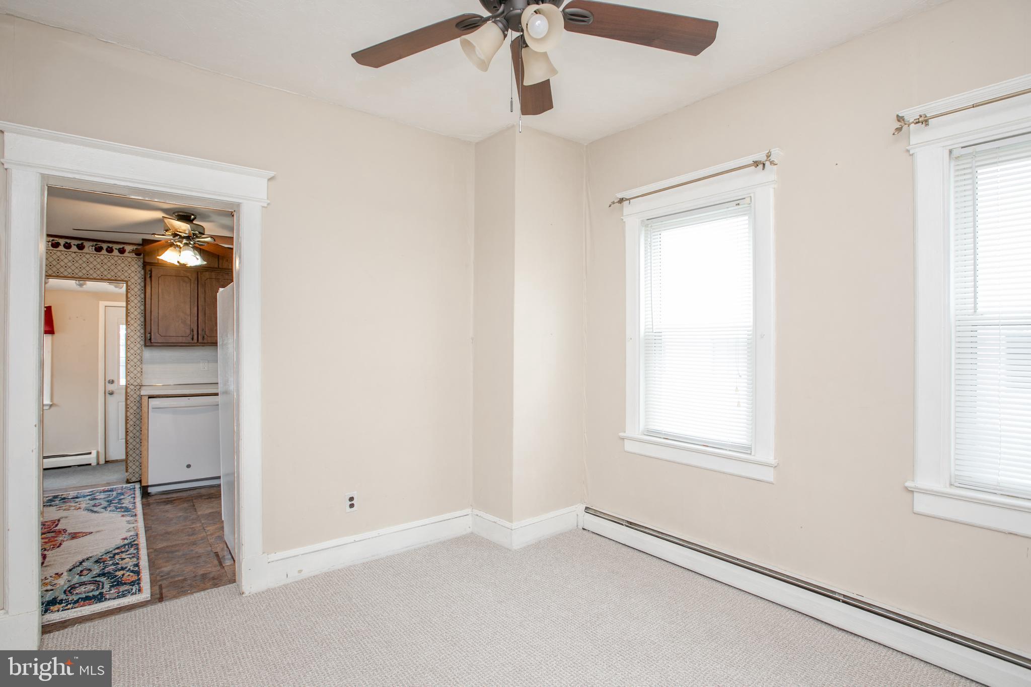 2414 Hamilton Avenue Hamilton, NJ 08619 - Photo 8 of 31 an empty room with windows and fan