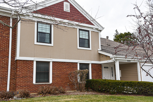 1560 7 Pines Road, Unit C1 Schaumburg, IL 60193 - Photo 1 of 17 a front view of a house with garden
